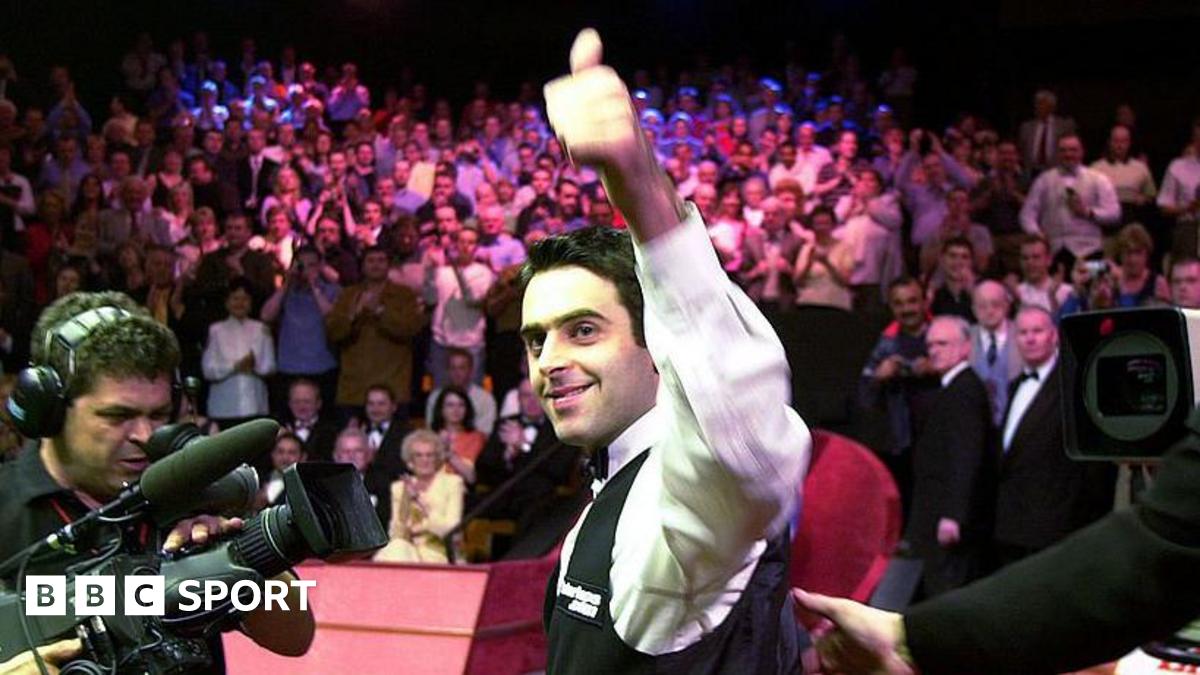 Ronnie O'Sullivan smiles and celebrates with a thumbs-up gesture after winning the 2001 World Championship