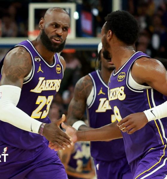 LeBron James and son Bronny on court for LA Lakers against Golden State Warriors