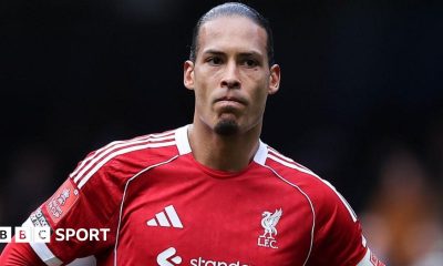 Liverpool captain Virgil van Dijk looks on as he stands with his hands resting on his hips after Liverpool's FA Cup defeat by Manchester City