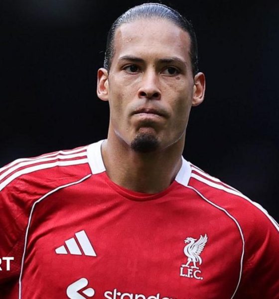 Liverpool captain Virgil van Dijk looks on as he stands with his hands resting on his hips after Liverpool's FA Cup defeat by Manchester City