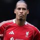 Liverpool captain Virgil van Dijk looks on as he stands with his hands resting on his hips after Liverpool's FA Cup defeat by Manchester City