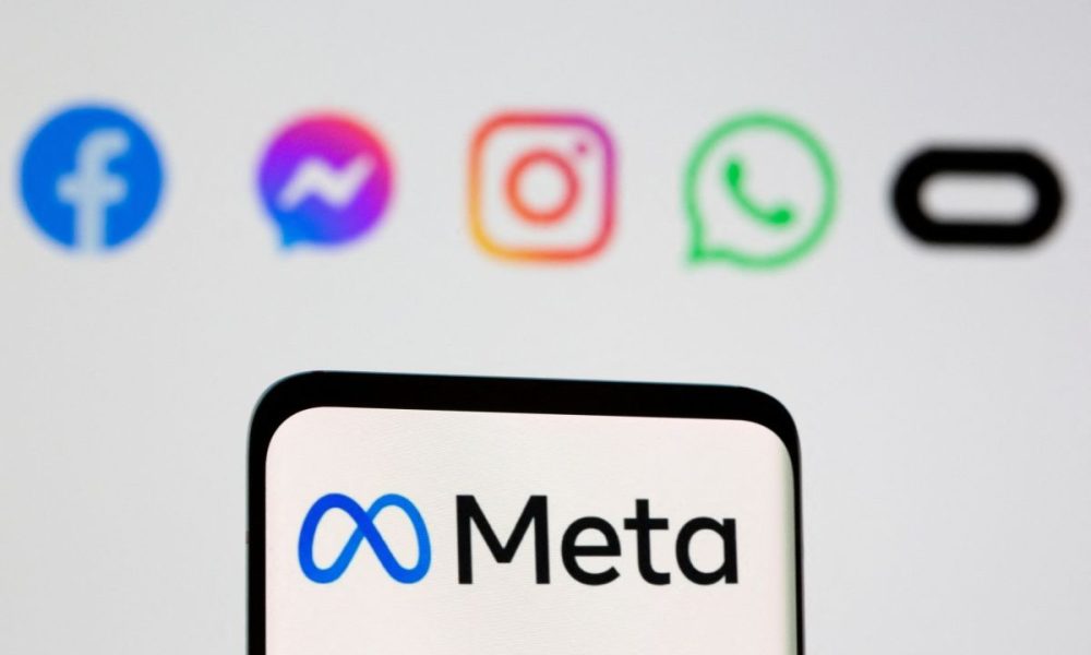 Facebook's new rebrand logo Meta is seen on smartpone in front of displayed logo of Facebook, Messenger, Intagram, Whatsapp, Oculus in this illustration picture taken October 28, 2021.