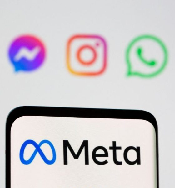 Facebook's new rebrand logo Meta is seen on smartpone in front of displayed logo of Facebook, Messenger, Intagram, Whatsapp, Oculus in this illustration picture taken October 28, 2021.