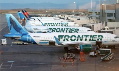 Frontier Airlines planes stand at gates on the A Concourse at Denver International Airport in Denver.