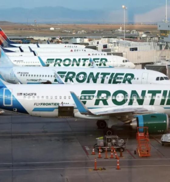 Frontier Airlines planes stand at gates on the A Concourse at Denver International Airport in Denver.