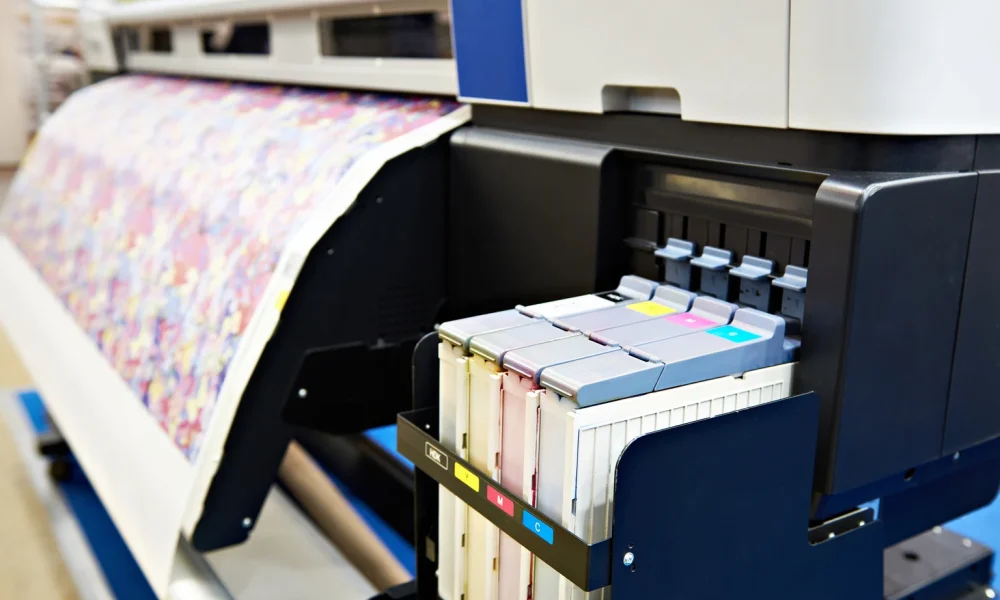 Wide format printer for on fabric and paper