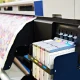 Wide format printer for on fabric and paper