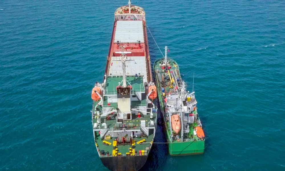 Refuelling at sea, Aerial image of a Small Oil products ship fuelling a large Bulk carrier.