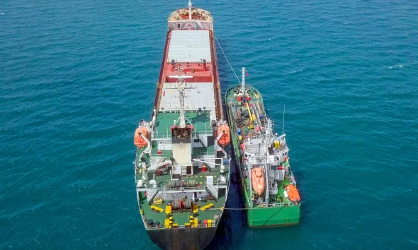Refuelling at sea, Aerial image of a Small Oil products ship fuelling a large Bulk carrier.