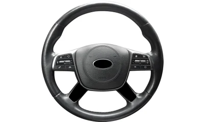 Modern car interior. Steering wheel with media phone control buttons isolated on white background. Car interior details. Steering wheel isolated on white background