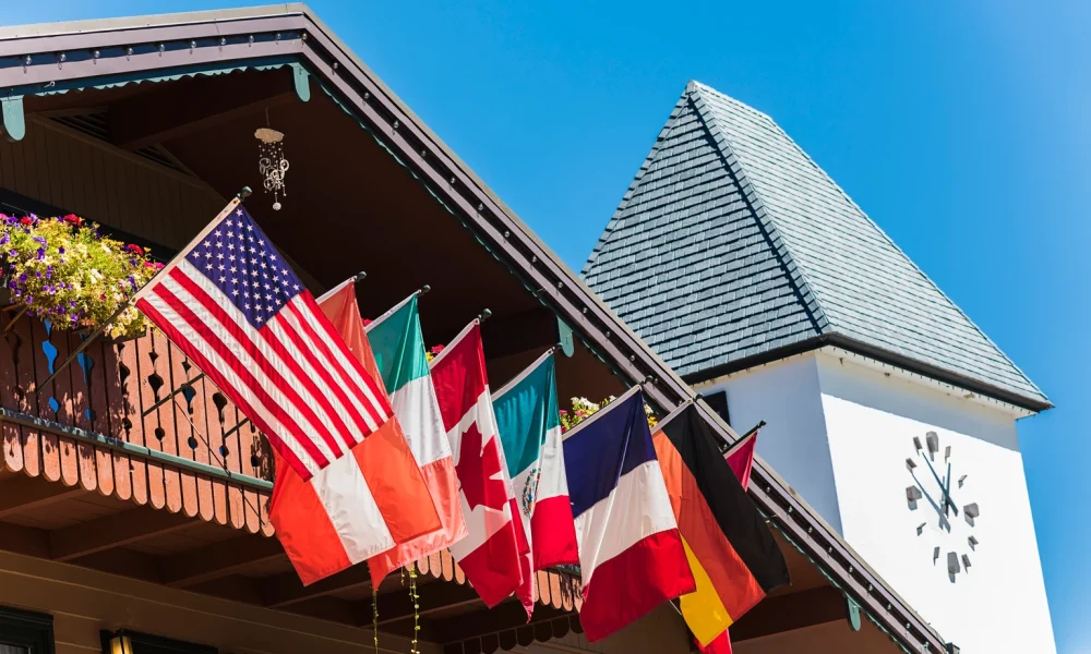 Clock Tower and Chalet Building with Flags in Vail, Colorado