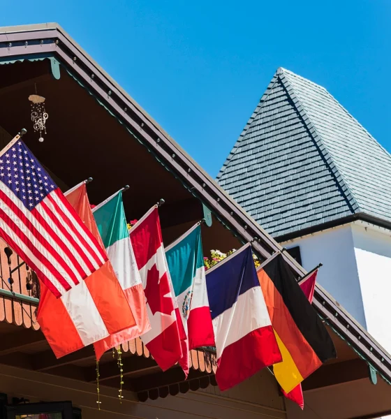 Clock Tower and Chalet Building with Flags in Vail, Colorado