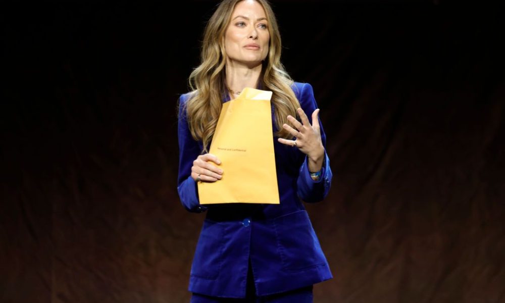 LAS VEGAS, NEVADA - APRIL 26: Olivia Wilde speaks onstage during CinemaCon 2022 - Warner Bros. Pictures "The Big Picture" Presentation at The Colosseum at Caesars Palace during CinemaCon, the official convention of the National Association of Theatre Owne