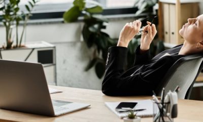 stressed out woman reclines in her chair, she's having a midlife career crisis