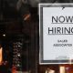 The number of job openings rose to 5.5 million in January. In this photo, a “Now Hiring” sign hangs on the door of the Urban Outfitters store at Quincy Market in Boston, Sept. 5, 2014.