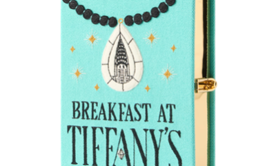 canvas clutch embroidered to look like the book BREAKFAST AT TIFFANY'S by Truman Capote
