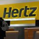 A person walks by the counter of Hertz rental car at John F. Kennedy International Airport in Queens, New York City, U.S., March 30, 2022.