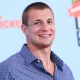 Rob Gronkowski posing on the red carpet.