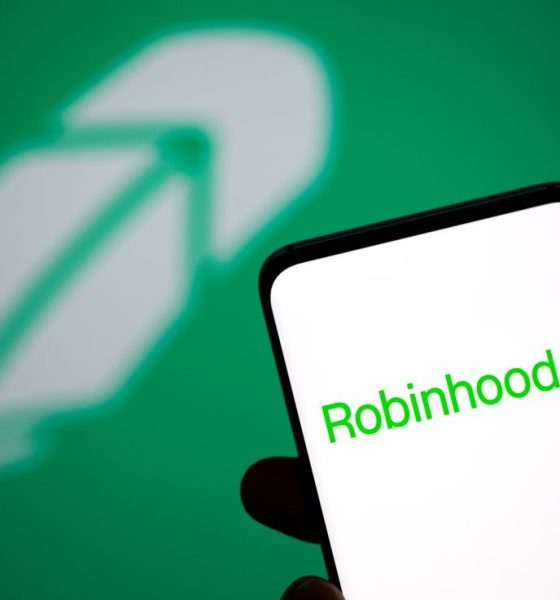 Robinhood logo is seen on a smartphone in front of a displayed same logo in this illustration taken, July 2, 2021.