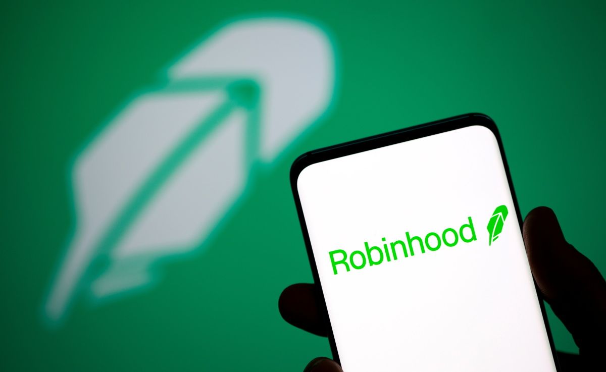 Robinhood logo is seen on a smartphone in front of a displayed same logo in this illustration taken, July 2, 2021.