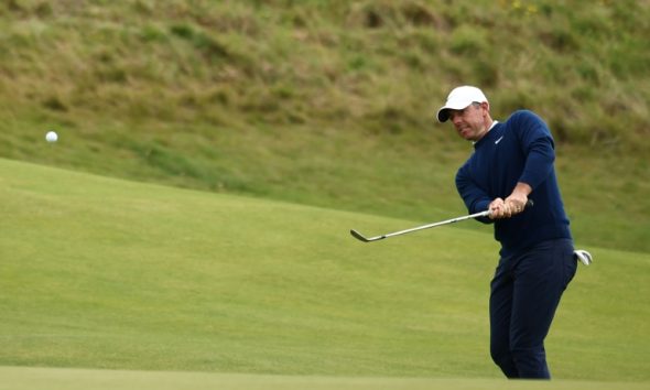 Rory McIlroy battled to stay in contention at the British Open