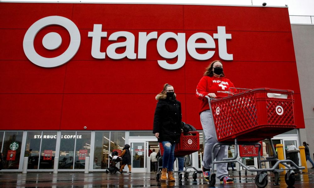 Shoppers exit a Target store during Black Friday sales in Brooklyn, New York, U.S., November 26, 2021.