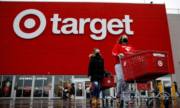 Shoppers exit a Target store during Black Friday sales in Brooklyn, New York, U.S., November 26, 2021.