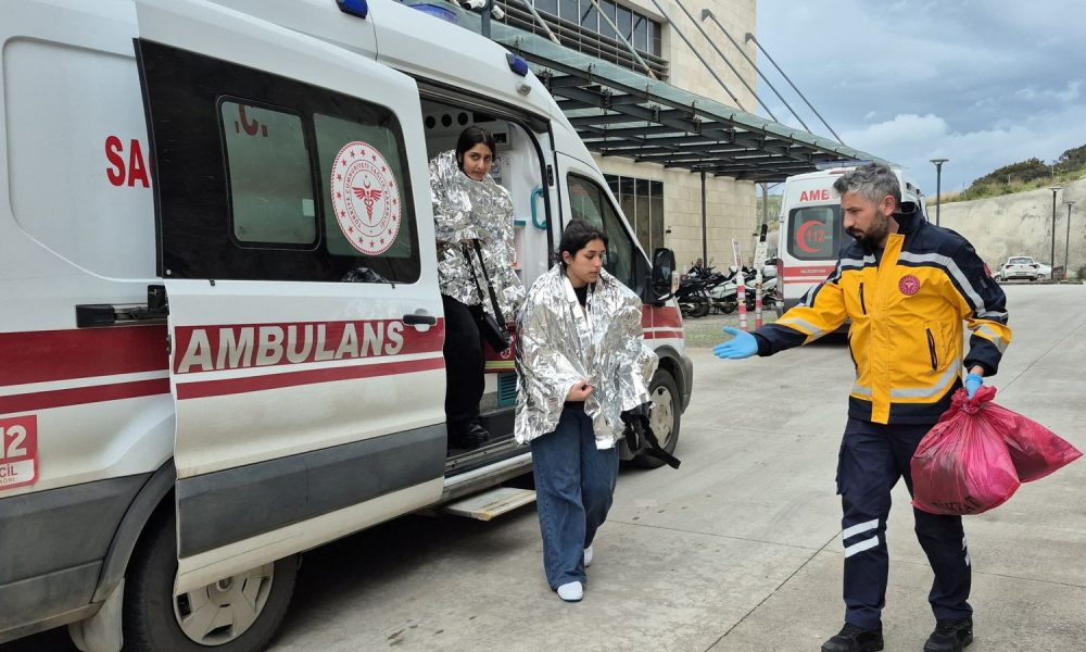 Rescued migrants, whose boat had capsized, arrive at a hospital in Bodrum, Turkey. Pic: Reuters