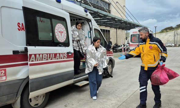 Rescued migrants, whose boat had capsized, arrive at a hospital in Bodrum, Turkey. Pic: Reuters