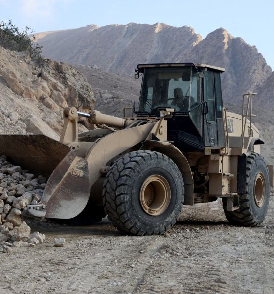 An excavator clears a road following a 2025 quake in Afghanistan's Balkh province. Pic: Reuters