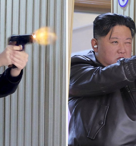 (L-R) Kim Ju Ae and Kim Jong Un fire pistols as they visit a munitions factory. Pic: Reuters