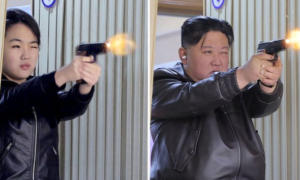 (L-R) Kim Ju Ae and Kim Jong Un fire pistols as they visit a munitions factory. Pic: Reuters