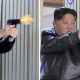 (L-R) Kim Ju Ae and Kim Jong Un fire pistols as they visit a munitions factory. Pic: Reuters