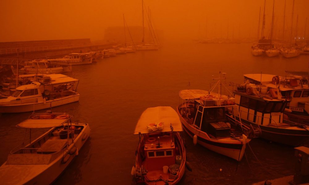 A view of the port in Heraklion, Crete, which is cloaked by red dust from Africa. Pic: Reuters