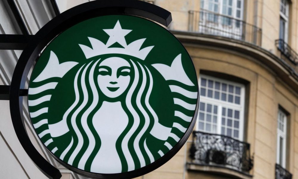 The Starbucks logo is seen outside the new Starbucks cafe in Warsaw