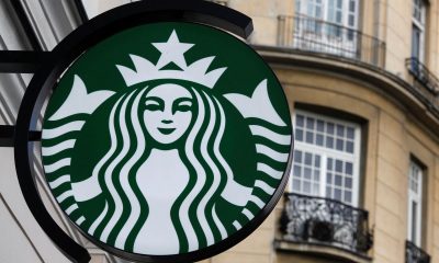 The Starbucks logo is seen outside the new Starbucks cafe in Warsaw