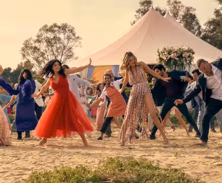 The cast of The Perfect Couple dancing in the opening credits