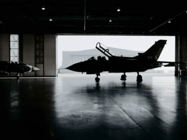 Military spending - an aircraft is stationary in an airplane hangar
