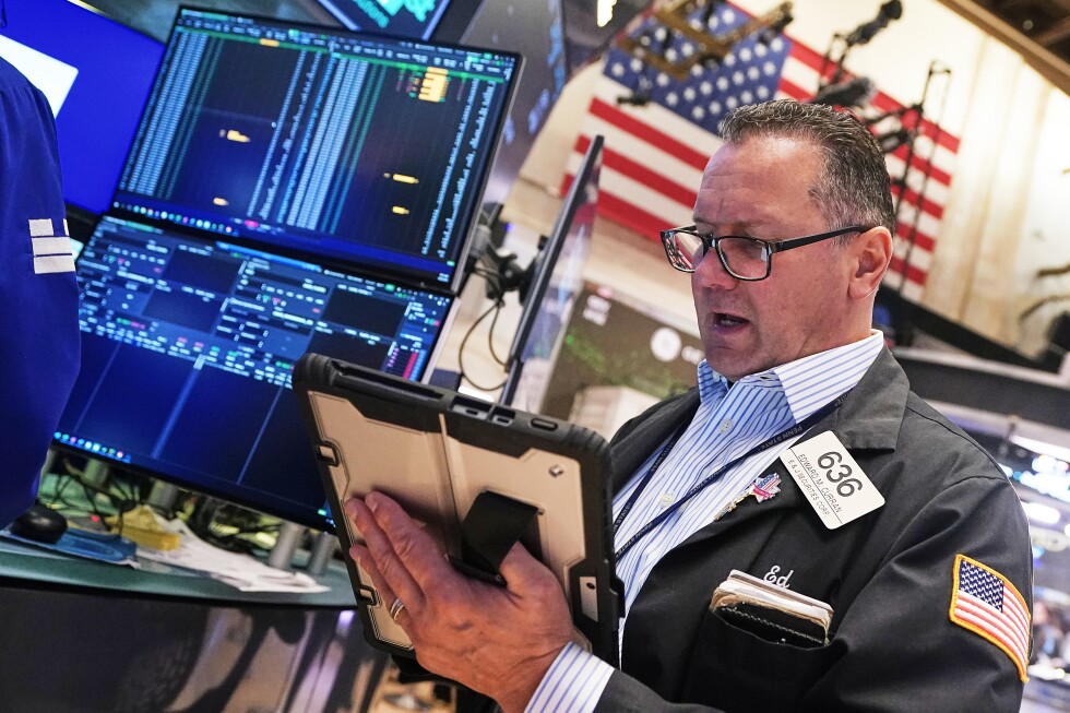 US stocks edge back from their records as oil prices swing higher