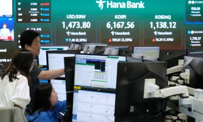 Asian shares mostly rise after Wall Street rallies on lower oil prices