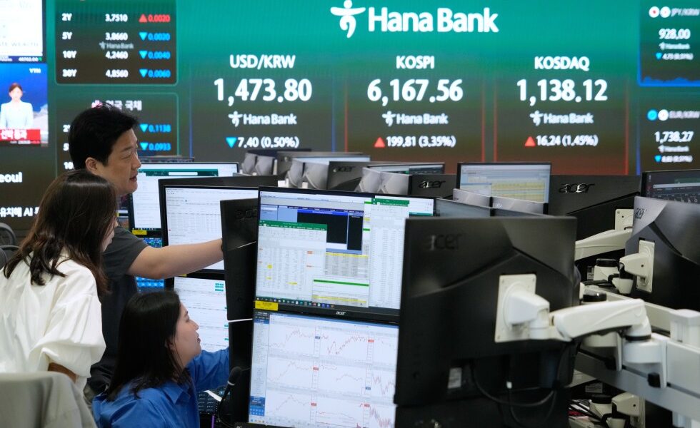 Asian shares mostly rise after Wall Street rallies on lower oil prices