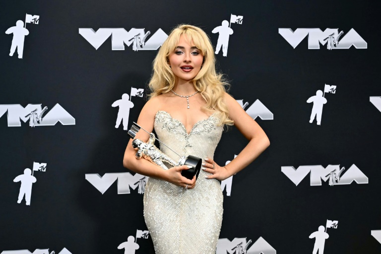 US singer Sabrina Carpenter poses in the pressroom with the VMA for Song of the Year for "Espresso"