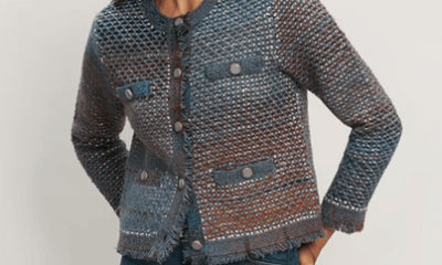 woman wears knit jacket that looks like tweed with an interesting blue and brown color scheme