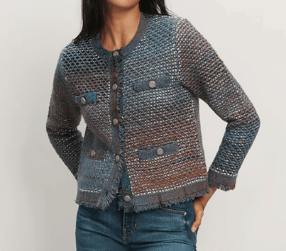 woman wears knit jacket that looks like tweed with an interesting blue and brown color scheme