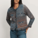woman wears knit jacket that looks like tweed with an interesting blue and brown color scheme