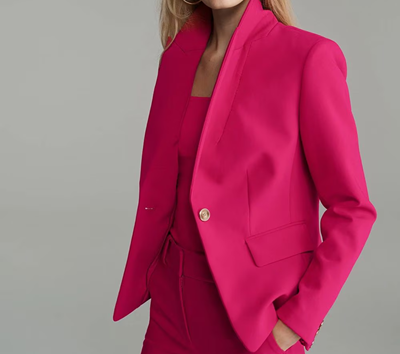 woman wears pink pantsuit