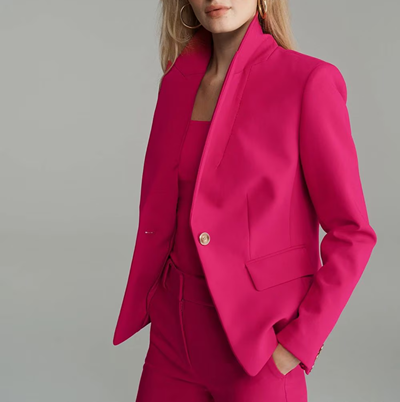 woman wears pink pantsuit