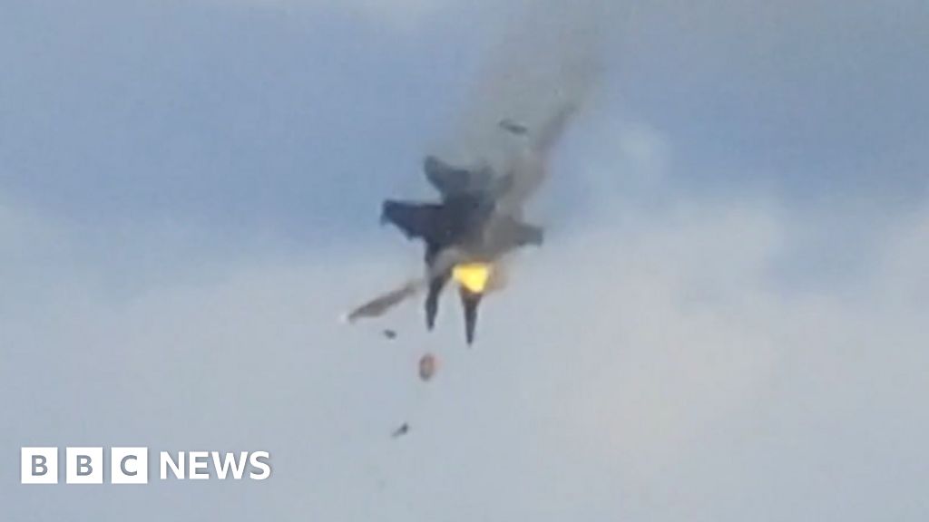 Moment two fighter jets collide mid-air during US air show