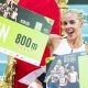 Keely Hodgkinson poses on a throne after breaking the world indoor 800m record