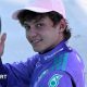Mercedes' Kimi Antoenlli looks back, smiles and gives the thumbs-up signal after taking pole position for the Miami Grand Prix